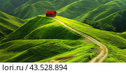 An impressive spring landscape with green hills and a red house. Background for the design. Стоковое AI-изображение, AI-художник Ярославский Максим / Фотобанк Лори