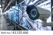Security Camera with Quad Monitor and On-Screen Interface. Стоковое AI-изображение, AI-художник Юрий Поздников / Фотобанк Лори