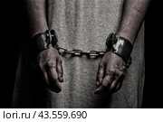 Женщина со связанными руками, заключенная в комнате, руки связаны. Стоковое фото, фотограф Сергей Тукач / Фотобанк Лори