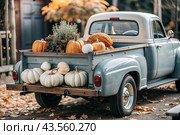 Autumn, autumn design. A large harvest of pumpkins on the back seat of a retro pickup truck, close-up. Стоковое AI-изображение, AI-художник Photojuli / Фотобанк Лори