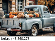 Autumn, autumn design. A large harvest of pumpkins on the back seat of a retro pickup truck, close-up. Стоковое AI-изображение, AI-художник Photojuli / Фотобанк Лори