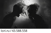 Силуэты двух спорящих людей распадающихся на части. Стоковое AI-изображение, AI-художник Александр Жуков / Фотобанк Лори