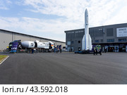 BERLIN - JUNE 07, 2024: SPACEBUZZ ONE truck of the German Space Agency at DLR and Model of the Ariane 6 space rocket by Arianespace in front of the space pavilion. ILA Berlin Air Show. Редакционное фото, фотограф Sergey Kohl / Фотобанк Лори
