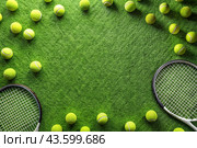 A yellow tennis ball and a tennis racket are lying on the lawn. A summer sport. Great tennis. Стоковое AI-изображение, AI-художник Photojuli / Фотобанк Лори