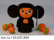 Чебурашка с апельсинами крупным планом (usb накопитель, флэш карта) Редакционное фото, фотограф Татьяна Костенко / Фотобанк Лори