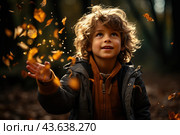 Little boy having fun during stroll in the forest at sunny autumn day. Child playing maple leaves. Baby tossing the leaves up. Active family time on nature. Hiking with little kids. Dry leaves rustle. Стоковое AI-изображение, AI-художник Ирина Михайличенко / Фотобанк Лори