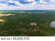 Arctic tundra in summer from an altitude of 2000 meters. Cloudy sky. Variety of colors and landscapes. The vastness of pristine nature. Shadow from the clouds. Стоковое фото, фотограф Владимир Ендовицкий / Фотобанк Лори