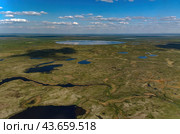 Arctic tundra in summer from an altitude of 2000 meters. Cloudy sky. Variety of colors and landscapes. The vastness of pristine nature. Shadow from the clouds. Стоковое фото, фотограф Владимир Ендовицкий / Фотобанк Лори