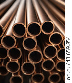 Copper bronze heat exchanger pipes. Heavy non-ferrous metallurgy. Factory industrial production of metal cuprum pipes. Heat exchanger is a technical device in which heat is exchanged between two media. Стоковое AI-изображение, AI-художник Юлия Петровская / Фотобанк Лори