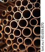 Copper bronze heat exchanger pipes. Heavy non-ferrous metallurgy. Factory industrial production of metal cuprum pipes. Heat exchanger is a technical device in which heat is exchanged between two media. Стоковое AI-изображение, AI-художник Юлия Петровская / Фотобанк Лори