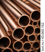 Copper bronze heat exchanger pipes. Heavy non-ferrous metallurgy. Factory industrial production of metal cuprum pipes. Heat exchanger is a technical device in which heat is exchanged between two media. Стоковое AI-изображение, AI-художник Юлия Петровская / Фотобанк Лори