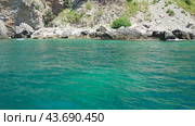 Cave Pecin bay between Petrovac - Sutomore. Hills, inaccessible rocks. Montenegro Flysch, marine sedimentary rocks, lithological layers. Adriatic Mediterranean sea Vezirova Ratkova Plaza, Budva (2024 год). Стоковое видео, видеограф Юлия Петровская / Фотобанк Лори