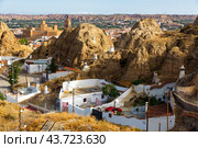 Aerial view of underground dwellings district and Moorish Castle in Guadix, Spain. Стоковое фото, фотограф Яков Филимонов / Фотобанк Лори
