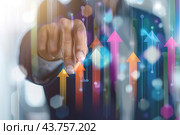 Increased profits. Benchmarking. Businessman analyzes profitability of working companies with digital augmented reality graphics, positive indicators, growing up graph and charts, colorful arrows. Стоковое AI-изображение, AI-художник Марина Демидюк / Фотобанк Лори