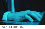 A person working with a laptop and a mobile phone at the same time is the idea of a quick implementation of the project. Stress and deadline conditions. Стоковое видео, видеограф Константин Скуридин / Фотобанк Лори