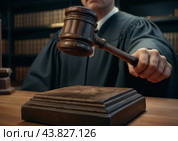 The judge's hammer in the judge's hand. Стоковое AI-изображение, AI-художник RamA / Фотобанк Лори