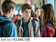 Teenage boy feeling excluded by classmates at school. Стоковое AI-изображение, AI-художник Иван Рябоконь / Фотобанк Лори