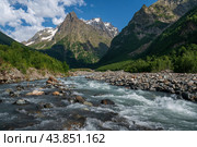 View of the Dombay-Ulgen gorge in the mountains of the North Caucasus near the village of Dombay on a sunny summer day, Karachay-Cherkessia, Russia. Стоковое фото, фотограф Ula Ulachka / Фотобанк Лори