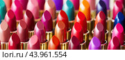 A symphony of shades: A bright palette of lipsticks in various colors. Стоковое AI-изображение, AI-художник Ярославский Максим / Фотобанк Лори
