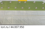 High-quality factory manufacturing. The adhesive material is applied to the metal in a checkered pattern to provide a stronger grip. Стоковое видео, видеограф Strunov David / Фотобанк Лори