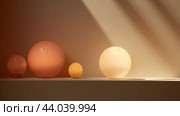 Abstract geometric composition with spheres and shadows on peach fuzz color background. Стоковое AI-изображение, AI-художник Анастасия Золотницкая / Фотобанк Лори