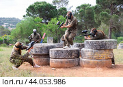 Paintball players of opposite teams in shootout. Стоковое фото, фотограф Яков Филимонов / Фотобанк Лори