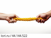 Tug of war - two hands pulling rope. Стоковое AI-изображение, AI-художник Иван Рябоконь / Фотобанк Лори