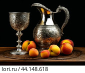Antique silver wine jug, silver goblet and peaches. Still life. Стоковое AI-изображение, AI-художник Сергей Елизарьев / Фотобанк Лори