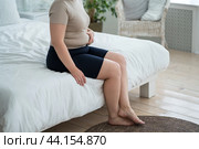 Tummy tuck, flabby skin on a fat belly, plastic surgery and liposuction concept. Стоковое фото, фотограф Станислав Тарко / Фотобанк Лори