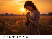 Serene woman praying in sunset field. Стоковое AI-изображение, AI-художник Иван Рябоконь / Фотобанк Лори