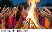 A group of women in colorful saris dancing around a bonfire, AI. Стоковое AI-изображение, AI-художник Сергей Старуш / Фотобанк Лори