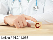 Chemical element Cr necessary for human health. essential vitamins and element for humans. Cr alphabet on wood cube. doctor recommends chrome. doctor talks about the benefits of chrome. Стоковое фото, фотограф Павел Муравьев / Фотобанк Лори