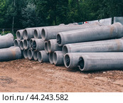 Concrete drainage pipes stacked. Construction cement pipes. Стоковое фото, фотограф Константин Григорьев / Фотобанк Лори