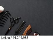 An Assortment of Professional Hairdressing Tools Laid Out on a Dark Surface. Стоковое фото, фотограф Сергей Толмачёв / Фотобанк Лори