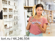 Woman standing and choosing metal soap dish. Стоковое фото, фотограф Яков Филимонов / Фотобанк Лори