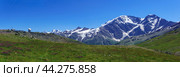 Panoramic mountain landscape with alpine meadow, observatory in the distance and mountain peaks in the background. Стоковое фото, фотограф Евгений Харитонов / Фотобанк Лори