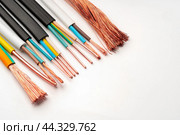 Various Electrical Wires With Exposed Copper Strands on White Background. Стоковое фото, фотограф Сергей Толмачёв / Фотобанк Лори