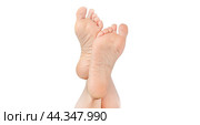 Rough skin on soles of feet. dry heels, dry chapped skin on feet requiring care isolated on white background, dry skin on heels and soles needs care. copy space. Стоковое фото, фотограф Павел Муравьев / Фотобанк Лори