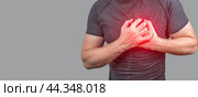 Heart attack. Man clutching his chest from acute pain. Heart attack symptom. Healthcare and medical concept. Стоковое фото, фотограф Павел Муравьев / Фотобанк Лори