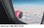 The camera approaches the porthole during the flight and reveals the beauty outside the plane. Стоковое видео, видеограф Ярославский Максим / Фотобанк Лори