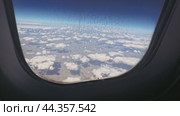 View of the clouds from the porthole during a flight on an airliner. Стоковое видео, видеограф Ярославский Максим / Фотобанк Лори