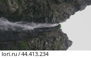 Awesome falls with a stream of cool, refreshing water on a cloudy day (2024 год). Редакционное видео, видеограф Strunov David / Фотобанк Лори