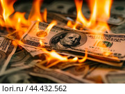 U.S. Dollar bills engulfed in flames, symbolizing financial loss or economic crisis. Стоковое AI-изображение, AI-художник Иван Рябоконь / Фотобанк Лори