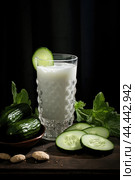 Glass of milk with fresh cucumber. Стоковое AI-изображение, AI-художник Veniamin Kraskov / Фотобанк Лори