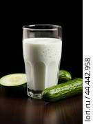 Glass of milk with fresh cucumber. Стоковое AI-изображение, AI-художник Veniamin Kraskov / Фотобанк Лори