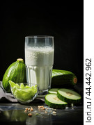 Glass of milk with fresh cucumber. Стоковое AI-изображение, AI-художник Veniamin Kraskov / Фотобанк Лори