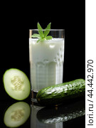 Glass of milk with fresh cucumber. Стоковое AI-изображение, AI-художник Veniamin Kraskov / Фотобанк Лори