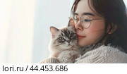 Young beautiful smiling brunette woman holds your tabby cat in her hands isolated on a light gray background. Good friends. Friendship of a pet and its owner girl. Cuddles. Copy space for text banner. Стоковое AI-изображение, AI-художник Марина Демидюк / Фотобанк Лори