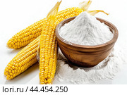 Fresh corn cobs and cornflour on white background. Стоковое AI-изображение, AI-художник Иван Рябоконь / Фотобанк Лори