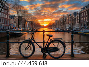 Tranquil Bicycle amsterdam bridge sunset. Generate Ai. Стоковое AI-изображение, AI-художник Иван Рябоконь / Фотобанк Лори
